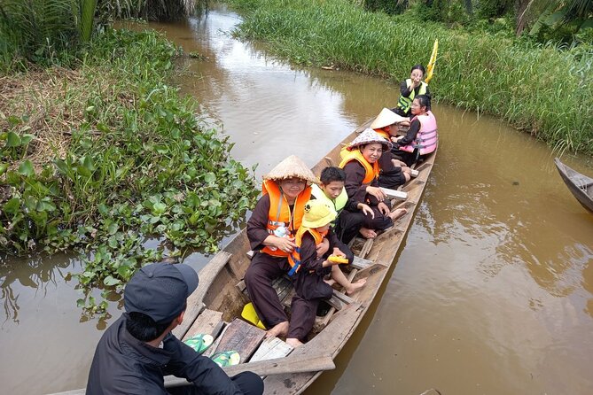 Cu chi Tunnel & Mekong Delta Full Day BBQ Lunch Lux Group 10 pax - Coconut candy, fishing villages, and floating homes