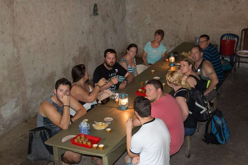 Cu Chi Tunnels Half-Day: Big Group Vietnam War Experience - Cassava and tea offer a small taste of wartime life