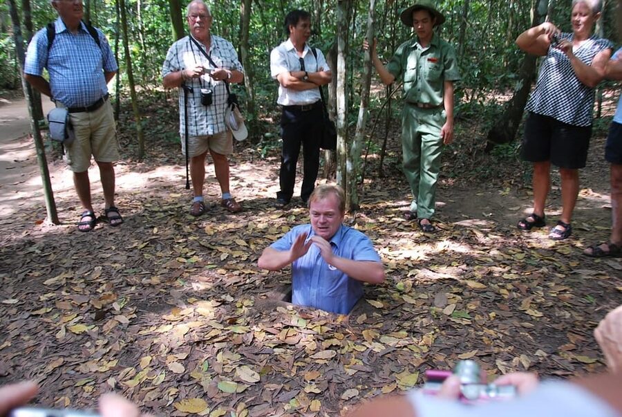 Explore Cu Chi Tunnels or Mekong Delta, or Both - A sampan through palm-lined canals