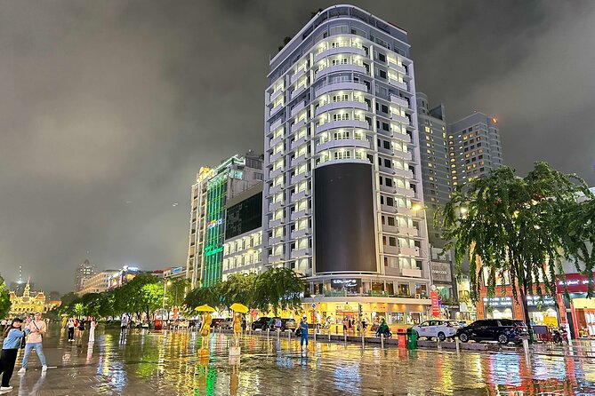 [Free E-sim] Evening Walking Tour in Saigon - % Arabica and a building with more than 30 cafés