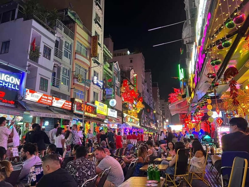 Free E-sim Saigon Nightlife Hopping Tour - From Vincom Center to Saigon after dark