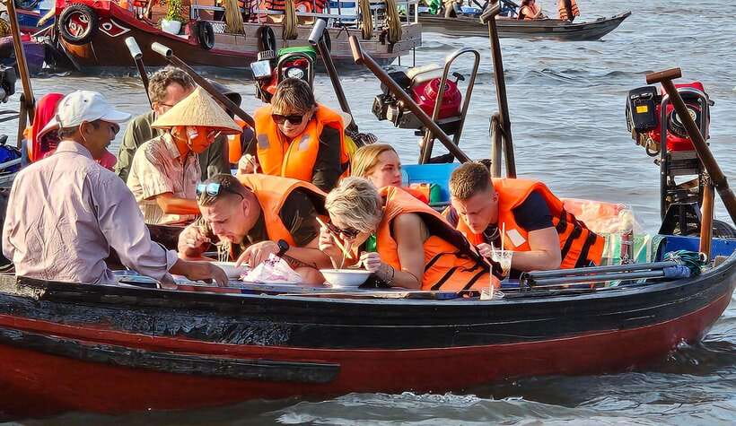 From HCM: Mekong Delta Can Tho Floating Market 2-Day Tour - Ben Tre canals, coconut candy, and folk music