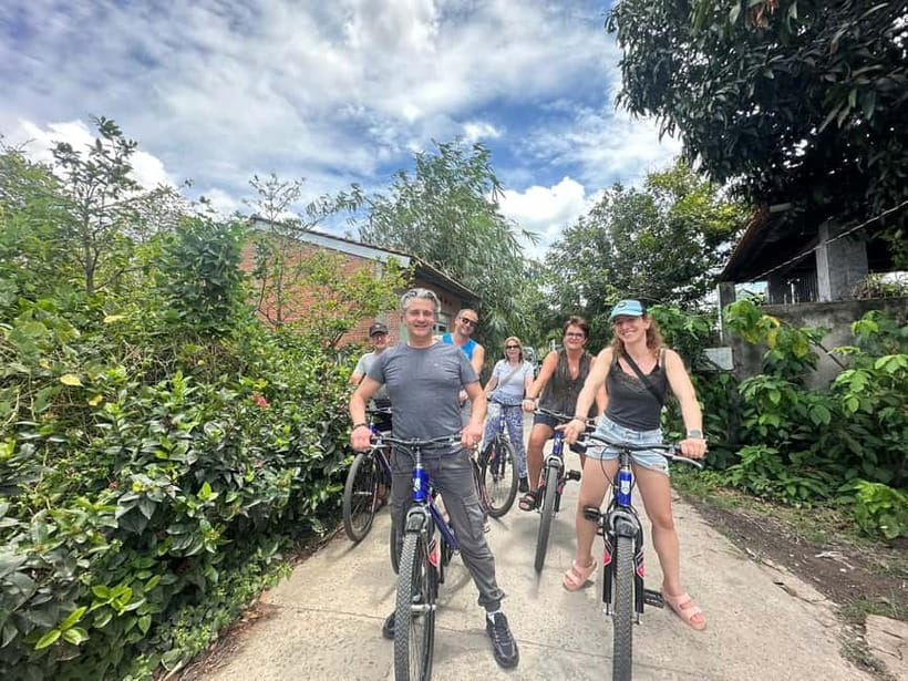 From Ho Chi Minh: Cai Be Boat & Bike Mekong Delta Experience - Cycling through Tien Giang village lanes