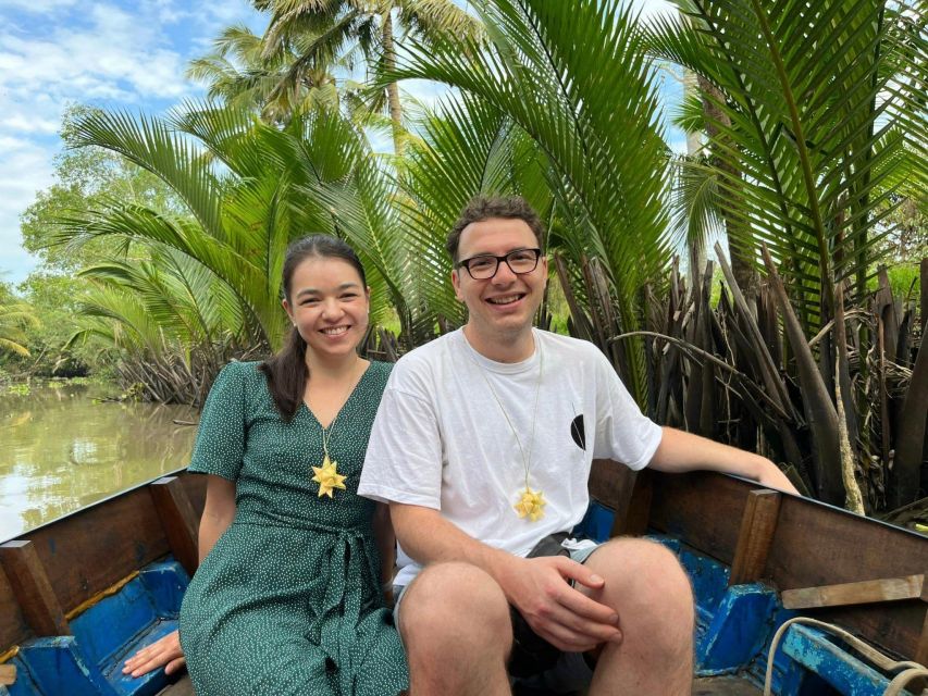 From Ho Chi Minh: Explore Mekong Delta & Vinh Trang Pagoda - Rowing through a narrow canal
