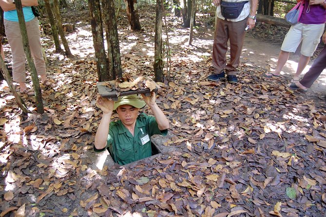 Full day Cu Chi Tunnels And Mekong Delta Guided Tour - Entering the Cu Chi Tunnels