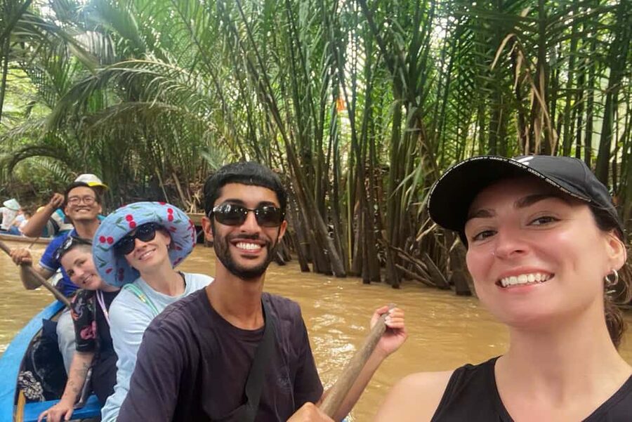 HCM: Cu Chi Tunnels and Mekong Delta Tour - Honey tea, fruit, coconut candy, and folk music
