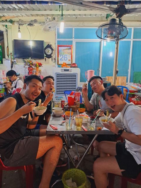 Ho Chi Minh City: Food Tour by Scooter with Eleven Tastings - The old apartment area and a bowl of bún bò Huế