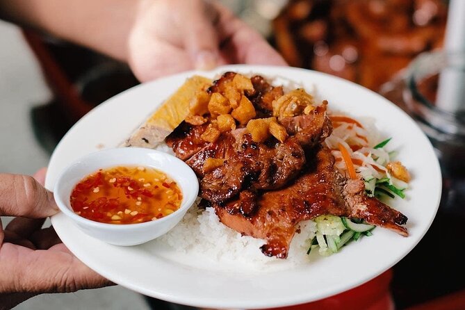 Ho Chi Minh City Signature Local Street Food by scooter Tour - Vietnamese food served in a moving city