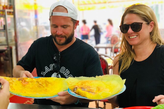 Ho Chi Minh City Street Food Tour & Sightseeing By Motorbike - Bánh khọt among the Nguyễn Thiện Thuật apartments