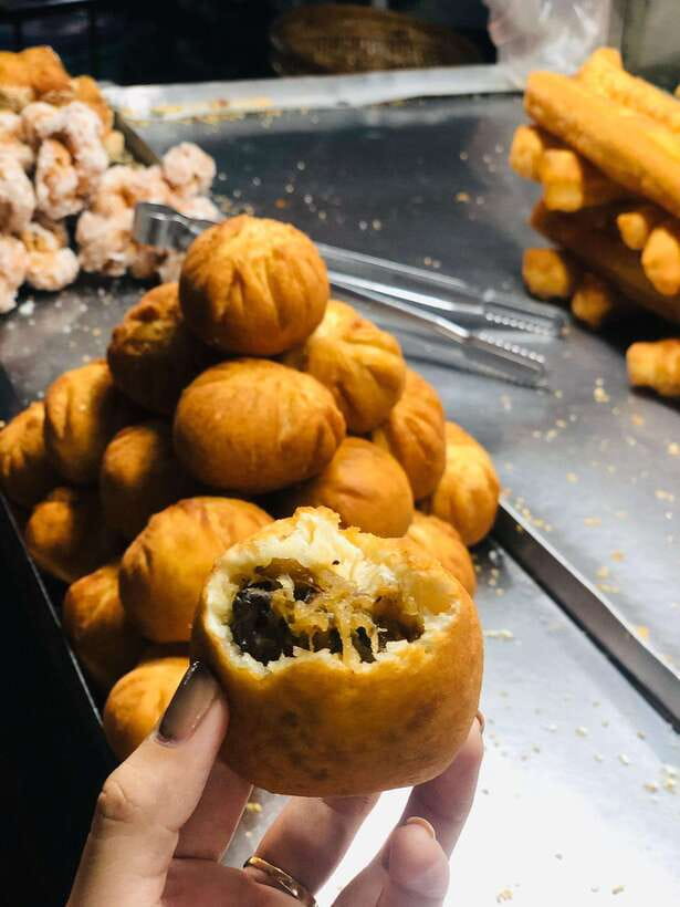 Ho Chi Minh City: Walking Food Tour with 13 Tastings - District 10 brings the heartier dishes