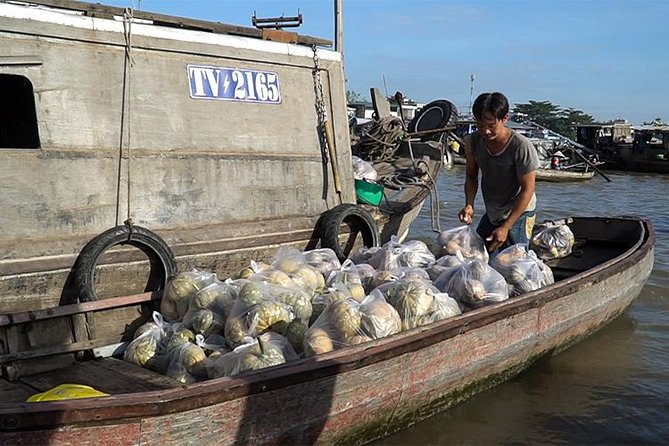 Mekong Delta Floating Market Luxury Group Tour - Local products, rice paper, and rice wine