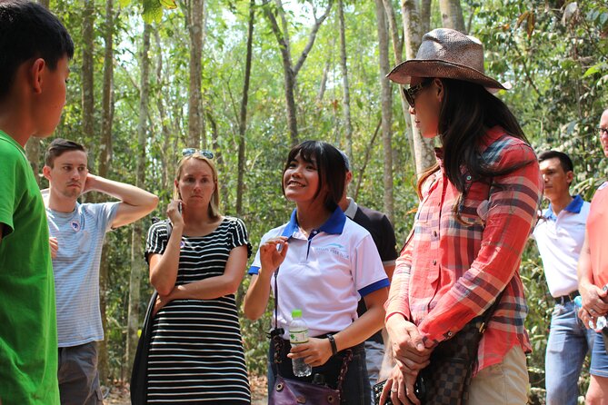 Premium Cu Chi Tunnels Tour with Local Expert by SpeedBoat - Walking through the restored tunnel area