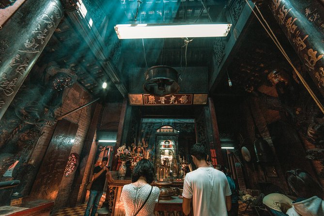 Private Ho Chi Minh City Half-Day Tour - Riding through Ho Chi Minh City in an air-conditioned minivan