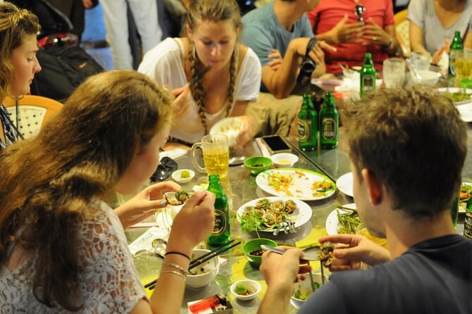 Private Jeep Tour Saigon by Night: Foodie & City Tour - Dinner at two restaurants, plus drinks above the city