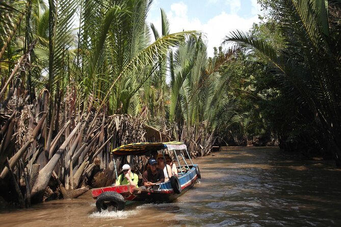 Private Mekong Delta Less Tourist - Coconut Island Tour - Honey tea, local products, and traditional music