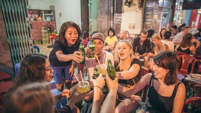Saigon at Sunset: Ultimate Street Food Experience - Evening beer, peanuts, and rice crackers