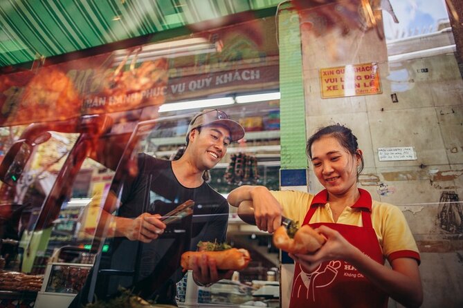 Saigon Night Bites on Foot: Local Vendors, Stories & Sweet Finish - Passing Chua Ba Thien Hau and Ong Lanh Bridge Market