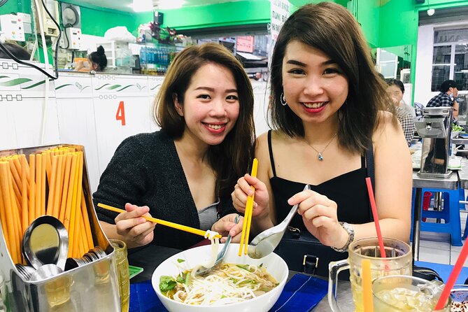 Saigon Night Scooter Experience And Local Food - District 7 and the Starlight Bridge pause