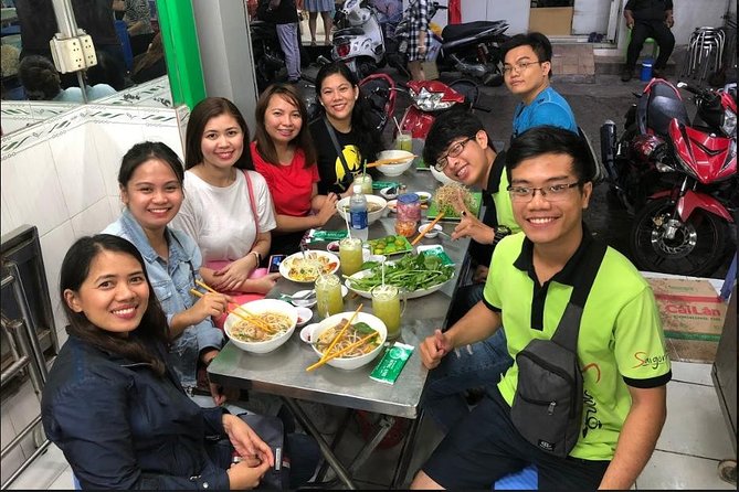 Saigon Night Sights & Local Food by Motorbike| Opt: Ao Dai Riders - Fish noodle soup and a building from 1986