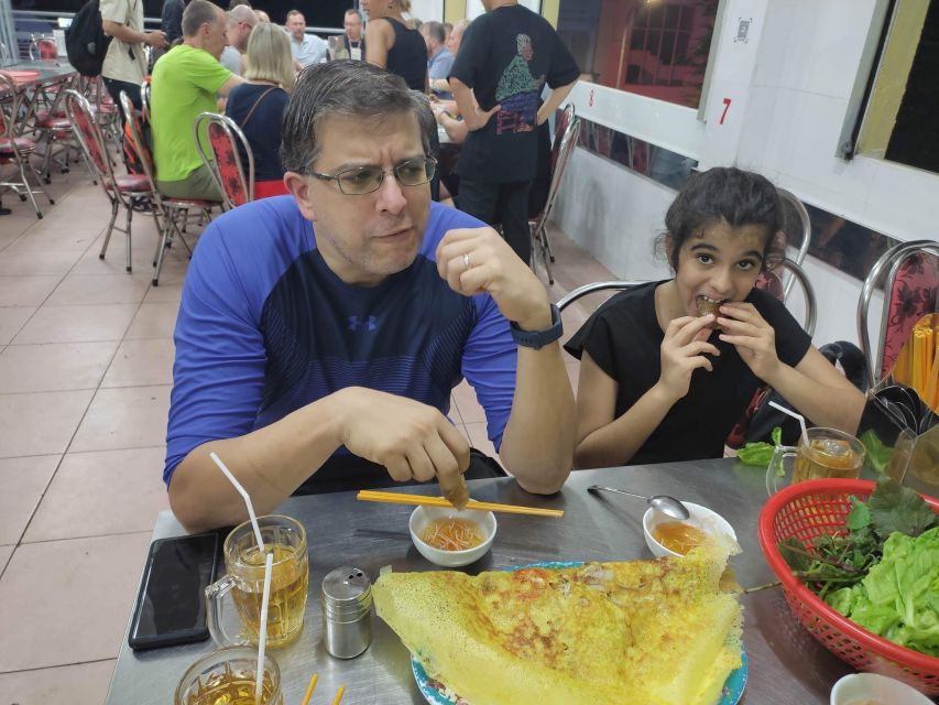 Saigon: Night Sightseeing And Street Food Tour By Vespa - Flowers and grilled rice paper near Saigon’s markets