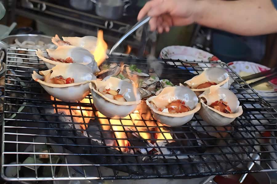 Saigon: Private Backstreets Walking Food Tour - Snacks, sugarcane juice, and the small details
