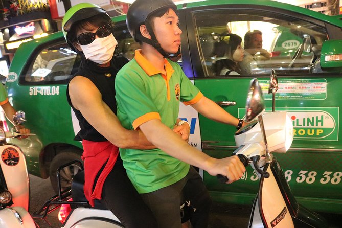 Saigon Vespa By Night Street Food Tour 4,5 Hours - Saigon after dark, seen from a Vespa